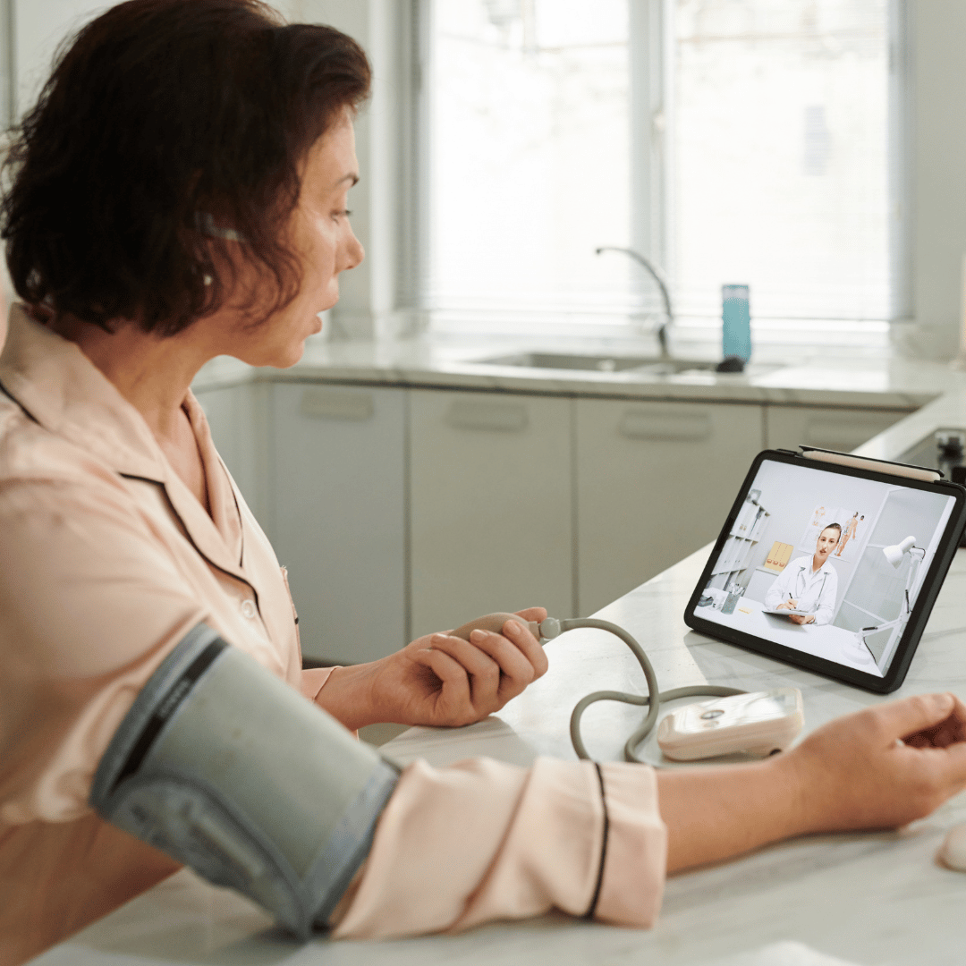 woman learning how to measure blood pressure at home